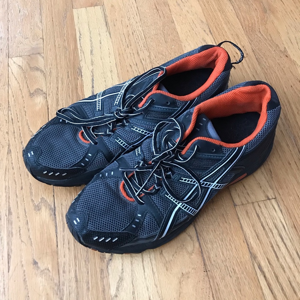 Dark gray asics with orange detail size 10